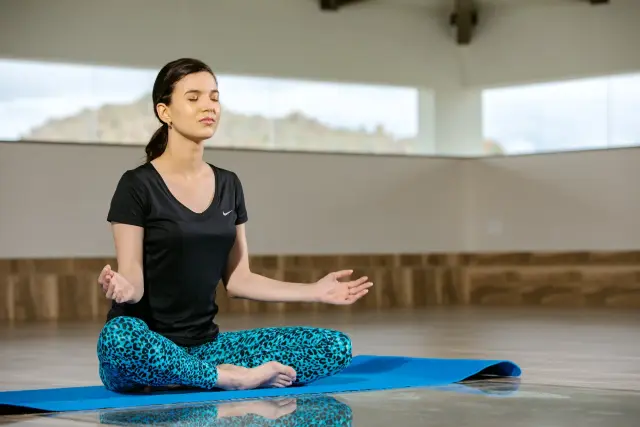 Meditation practice supporting Ayurvedic treatment for stress relief, hormonal balance, and overall wellness