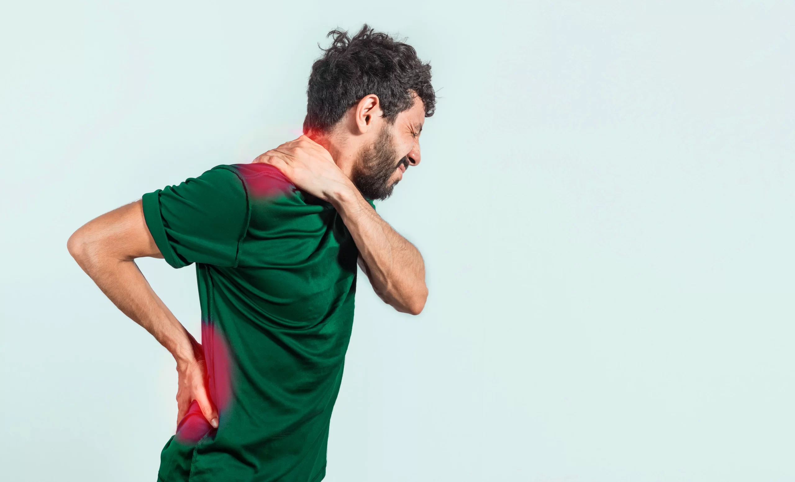 Man experiencing neck and lower back pain, representing Ayurvedic Panchakarma treatment for musculoskeletal relief